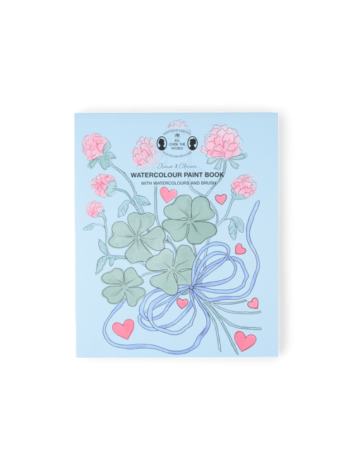 Livre d'aquarelle avec peinture et pinceau